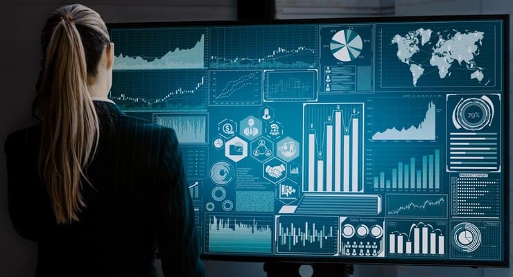 Hands working with holographic BI charts and gauges