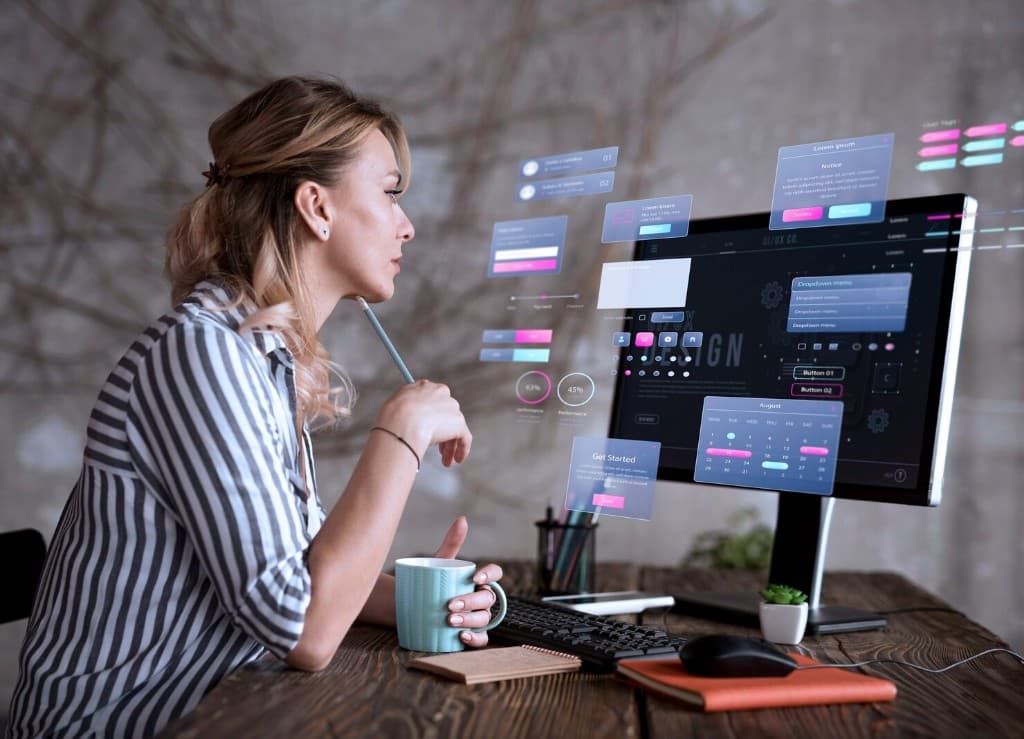 Designer working with floating UI and UX interface components